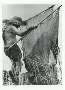 Fort Fisher Hermit fishing with a net.