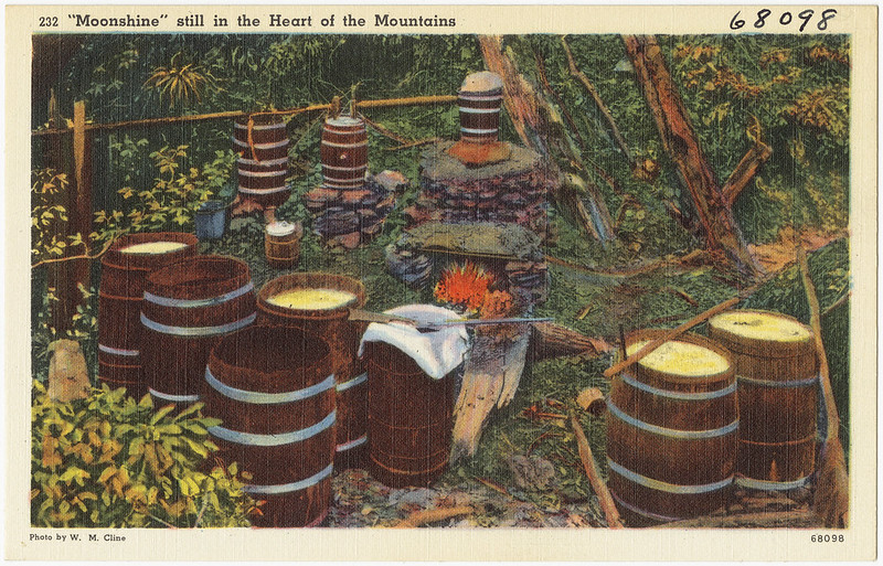 Color postcard of a moonshine still in the Appalachian mountains.