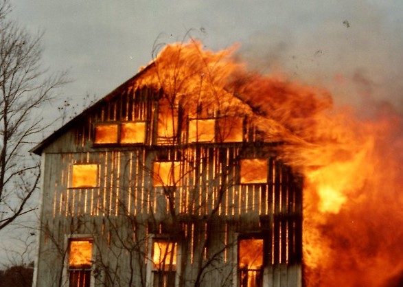 Photo of a barn on fire.