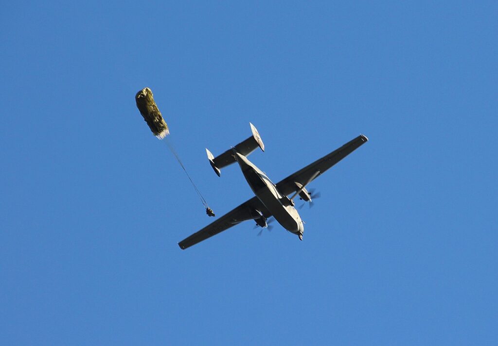 Parachutist exiting airplane