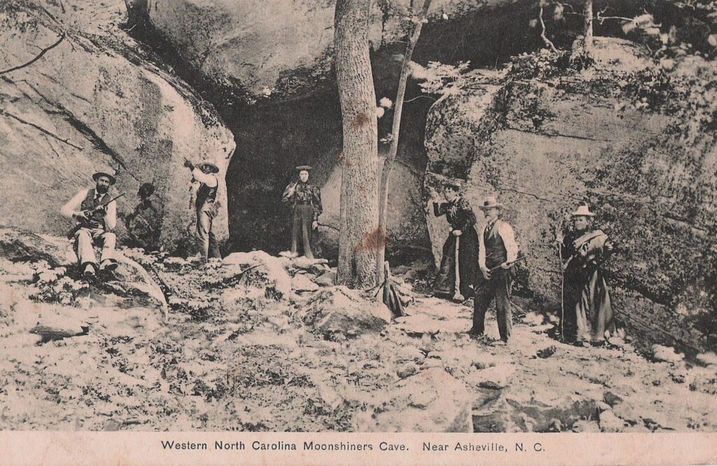 People standing outside a cave near Asheville, NC.